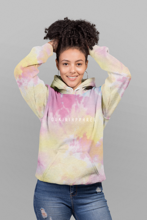 woman in a pink and yellow rainbow hoodie 