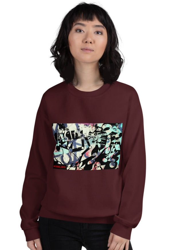 a woman in a maroon sweatshirt with a graffiti art print that is for streetwear