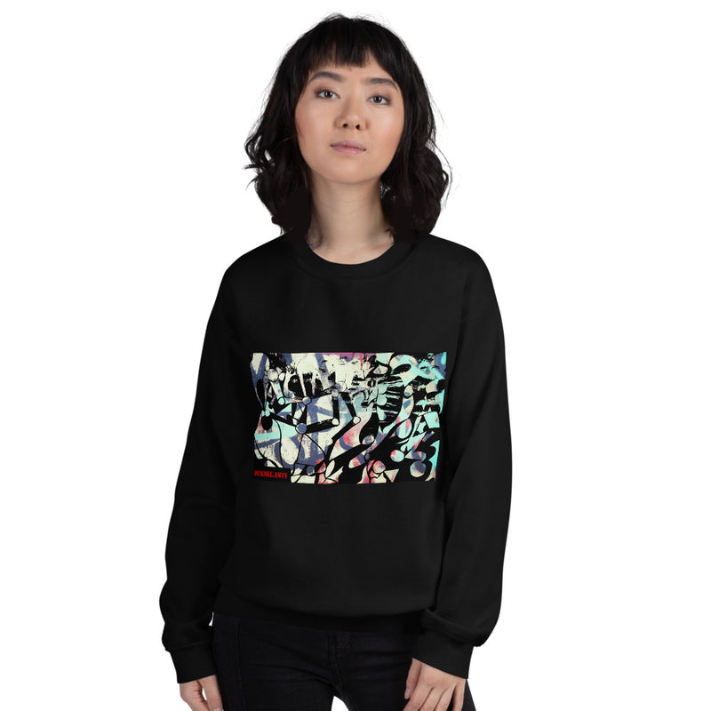 a woman in a black sweatshirt with a graffiti art print that is for streetwear created by dukiri apparel