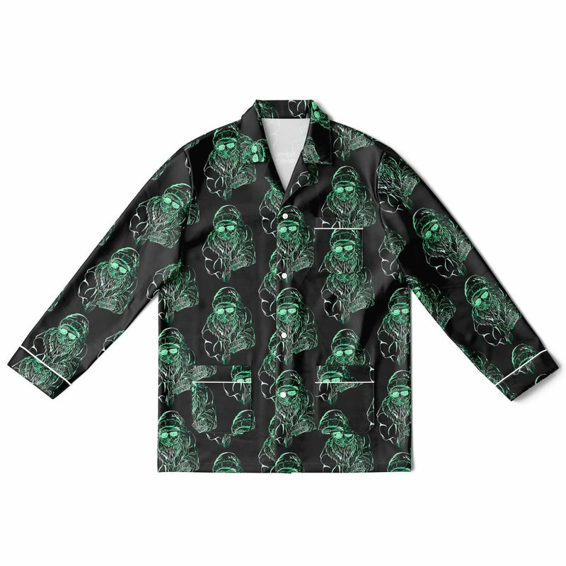 Black shirt with green alien pattern on a white background