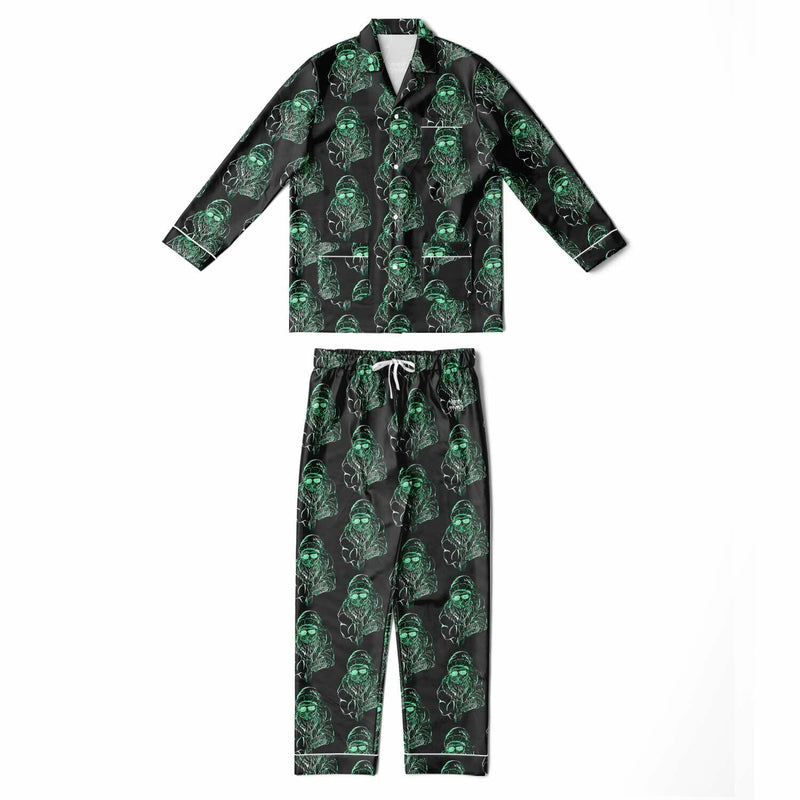 Pajama set with green skull pattern on a black background