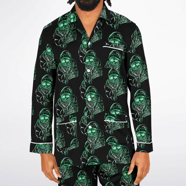 Black shirt with green graphic pattern worn by a person on a white background