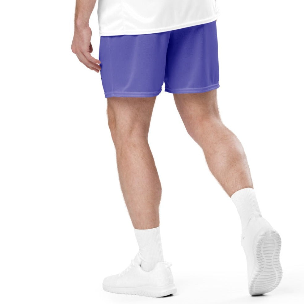 Fit white male model wearing purple mesh athletic shorts during outdoor workout, demonstrating flexibility and comfort.