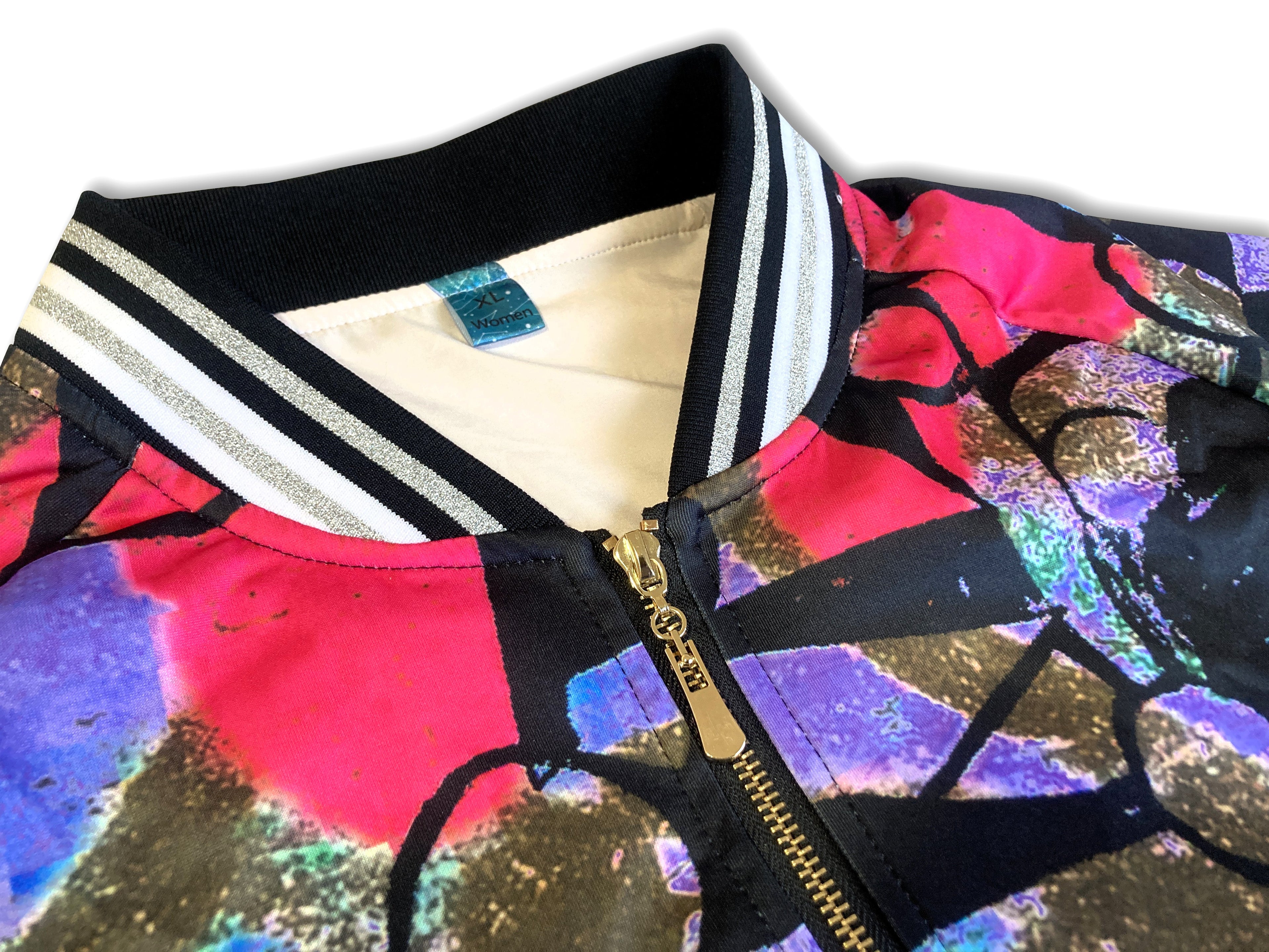 Close-up of a colorful jacket with a zipper and patterned fabric.