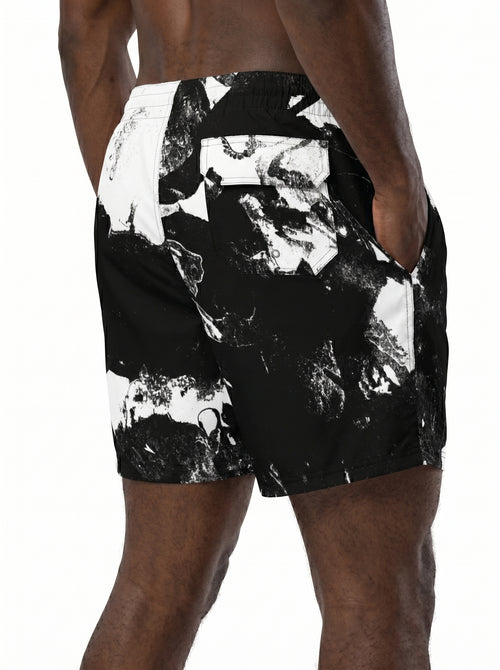 Black and white patterned shorts worn by a person on a white background