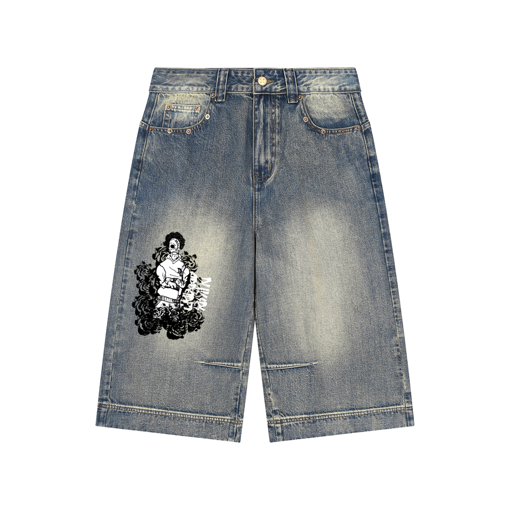 Light blue denim shorts with a black and white graphic print of a woman surrounded by flowers on the left leg, shown flat on a white background.