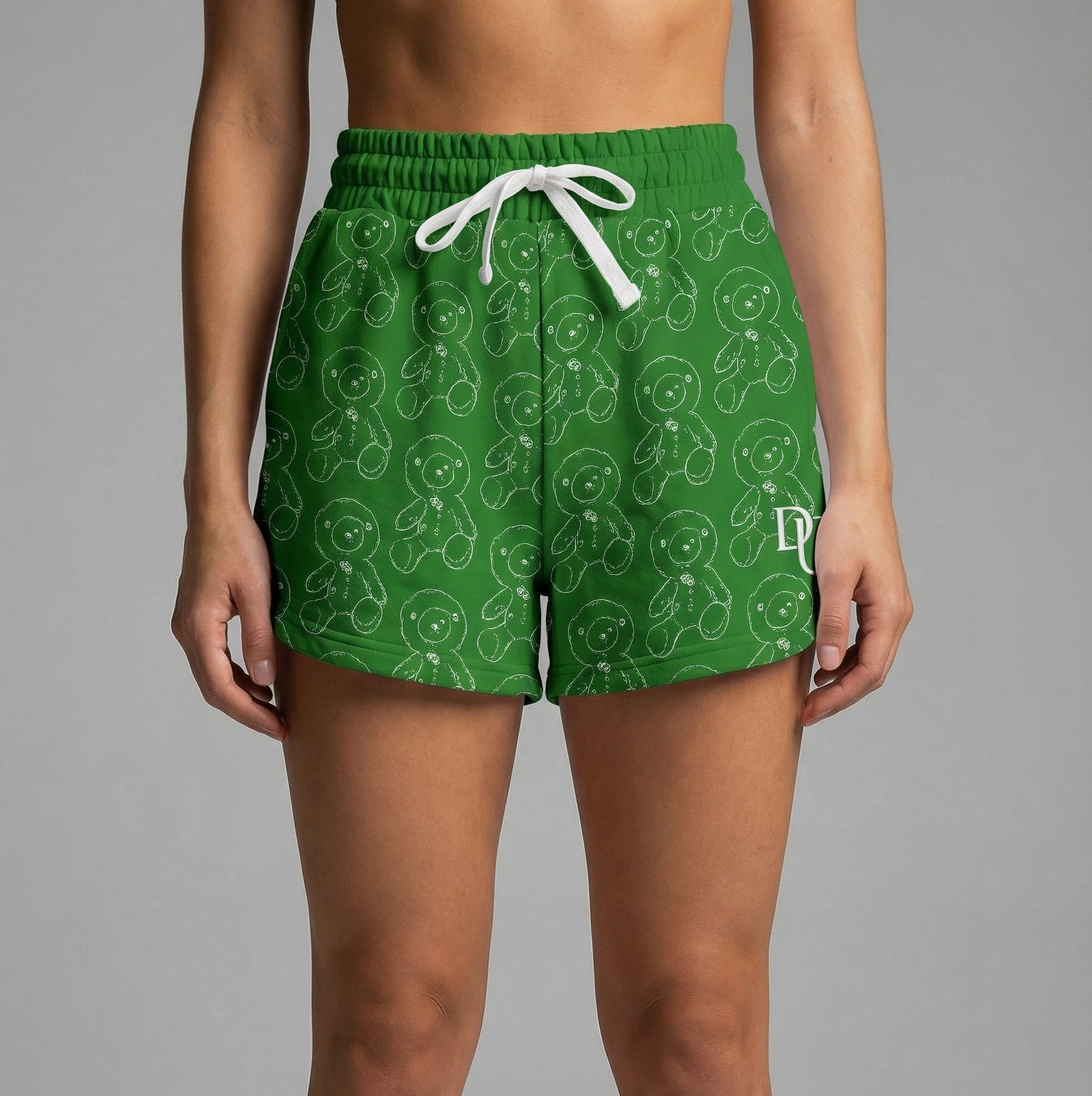 Green patterned shorts worn by a person on a gray background