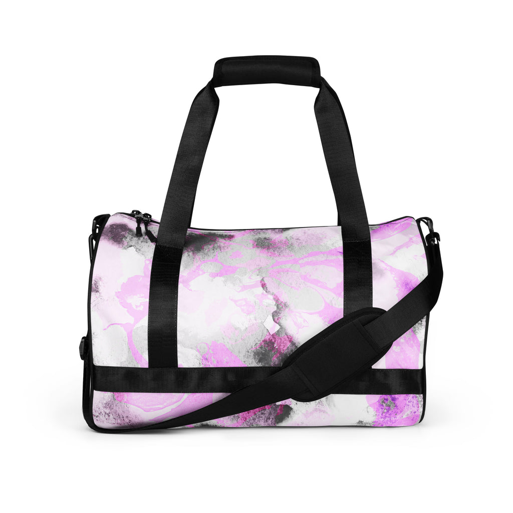 A black and purple gym bag with dual handles and a front pocket, displayed against a white background.