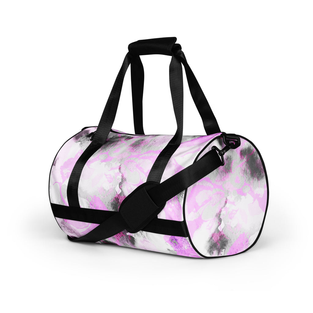 A black and purple gym bag with dual handles and a front pocket, displayed against a white background.