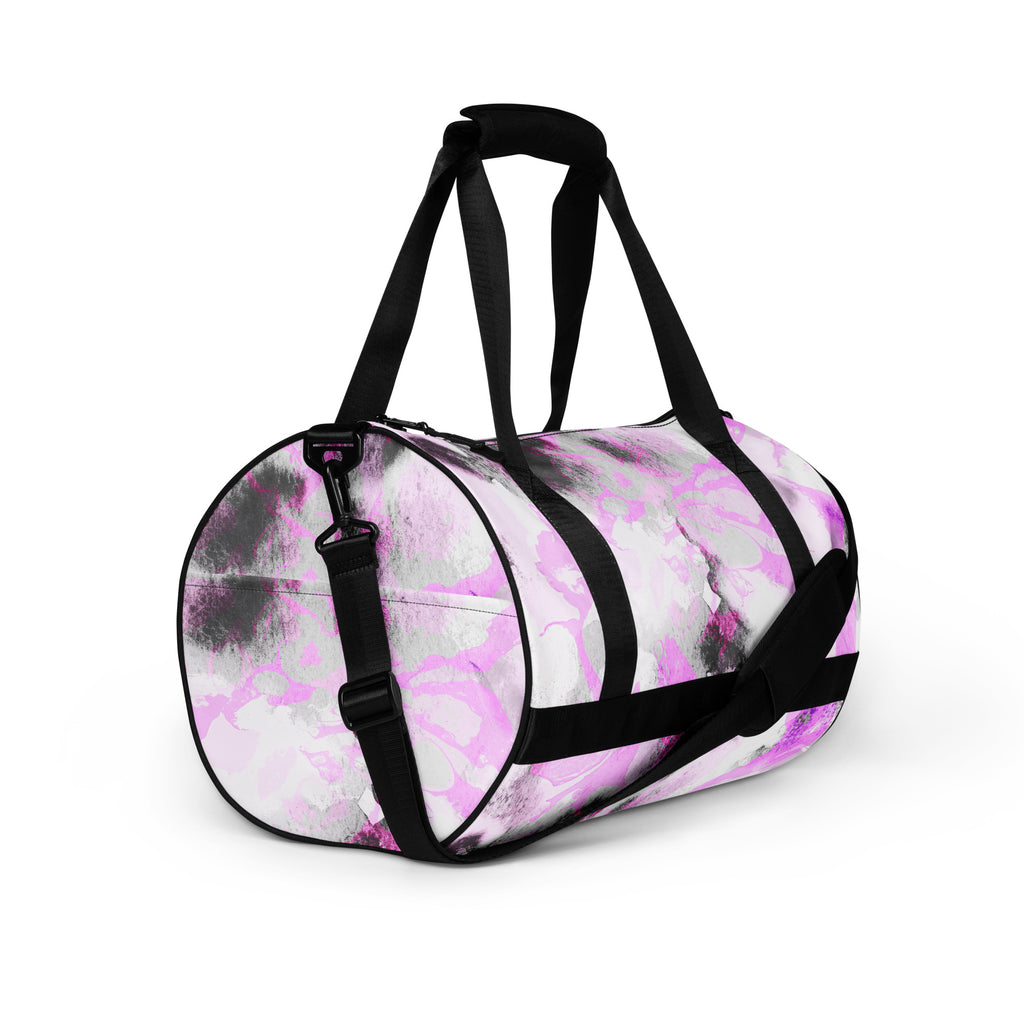 A black and purple gym bag with dual handles and a front pocket, displayed against a white background.