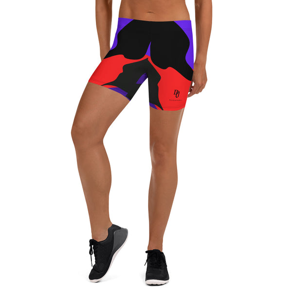 a woman wearing a pair of colorful shorts